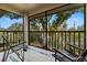 Relaxing screened porch with comfortable seating and view at 2087 Hunters Glen Dr # 126, Dunedin, FL 34698