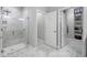 Bathroom featuring tile floors, a walk-in shower, and an open closet at 2270 Spring Lake Ct, Clearwater, FL 33763