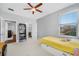 Clean bedroom with neutral walls, ceiling fan, and ample storage and closet space at 2270 Spring Lake Ct, Clearwater, FL 33763