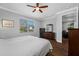 Nicely lit bedroom with hardwood floors, a ceiling fan, and a walk-in closet at 2270 Spring Lake Ct, Clearwater, FL 33763