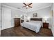 Bright main bedroom with en-suite bathroom access, a ceiling fan, and sleek wood flooring at 2270 Spring Lake Ct, Clearwater, FL 33763