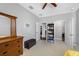 Lovely bedroom features a ceiling fan, a closet and a dresser with dark wood finish at 2270 Spring Lake Ct, Clearwater, FL 33763