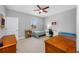 Spacious bedroom offers a ceiling fan, two twin beds and large windows with natural light at 2270 Spring Lake Ct, Clearwater, FL 33763