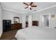 Comfortable bedroom featuring sleek wood flooring, a ceiling fan, and neutral wall paint at 2270 Spring Lake Ct, Clearwater, FL 33763