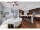 Stylish kitchen and dining area featuring dark wood cabinetry, stainless steel appliances, and a bright, inviting atmosphere at 2270 Spring Lake Ct, Clearwater, FL 33763