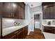 Well-equipped kitchen with abundant cabinets and a view into the laundry room at 2270 Spring Lake Ct, Clearwater, FL 33763
