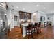 Modern kitchen island with bar seating, stainless steel appliances, and dark wood cabinetry, offering both style and function at 2270 Spring Lake Ct, Clearwater, FL 33763