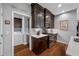 Kitchen area showing stainless steel appliances, a laundry area, and wood floors at 2270 Spring Lake Ct, Clearwater, FL 33763