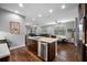 Open-concept kitchen with a large island, stainless steel appliances, and wood floors at 2270 Spring Lake Ct, Clearwater, FL 33763