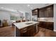 Modern kitchen featuring stainless steel appliances, a large island, and wood flooring at 2270 Spring Lake Ct, Clearwater, FL 33763