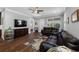 Cozy living room featuring a leather sectional and hardwood floors at 2270 Spring Lake Ct, Clearwater, FL 33763