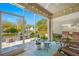 Inviting screened porch overlooking lush greenery and serene waterfront views at 2270 Spring Lake Ct, Clearwater, FL 33763