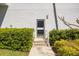 Building entrance featuring well-maintained landscaping and an inviting pathway at 2401 Bayshore Blvd # Cu1, Tampa, FL 33629