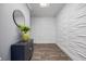 Hallway featuring unique 3-D wall paneling, modern furnishings, and an elegant mirror, creating a sophisticated ambiance at 2401 Bayshore Blvd # Cu1, Tampa, FL 33629