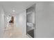 Hallway leading to unit featuring modern design elements and a glimpse of the comfortable interior at 2401 Bayshore Blvd # Cu1, Tampa, FL 33629