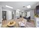 Bright living room with wood floors, gray walls, white trim, and a view into the restroom at 2401 Bayshore Blvd # Cu1, Tampa, FL 33629