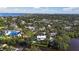 Stunning aerial view of a waterfront community with lush landscaping and beautiful homes at 2633 N Dundee St, Tampa, FL 33629
