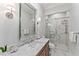 Elegant bathroom with marble countertops, a glass-enclosed shower, and modern fixtures at 2633 N Dundee St, Tampa, FL 33629