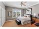 Cozy bedroom with a ceiling fan, natural light, and neutral decor for a relaxing ambiance at 2633 N Dundee St, Tampa, FL 33629