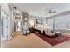 Spacious bedroom showcasing neutral tones, plantation shutters, and decorative rug at 2633 N Dundee St, Tampa, FL 33629