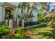Stunning Mediterranean-style home entrance with lush landscaping and a beautifully designed walkway at 2633 N Dundee St, Tampa, FL 33629