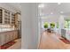 Modern kitchen featuring stainless steel appliances and an adjacent dining area with large windows at 2633 N Dundee St, Tampa, FL 33629