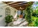 Charming outdoor space featuring a trellis, stylish seating and lush foliage, creating a tranquil escape at 2633 N Dundee St, Tampa, FL 33629