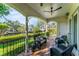 Inviting outdoor patio with wicker seating, overlooking lush landscaping and waterway, creating a serene retreat at 2633 N Dundee St, Tampa, FL 33629
