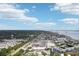 High aerial view highlighting the community's location and proximity to amenities, water, and highways at 2700 Bayshore Blvd # 9404, Dunedin, FL 34698