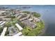 Attractive aerial perspective of a condo complex with serene waterfront views and mature trees at 2700 Bayshore Blvd # 9404, Dunedin, FL 34698