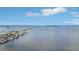 This high aerial view showcases the community's prime location on the water with clear, blue skies at 2700 Bayshore Blvd # 9404, Dunedin, FL 34698