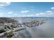 Aerial view of the community's waterfront location, the intercoastal and bridge with a blue sky backdrop at 2700 Bayshore Blvd # 9404, Dunedin, FL 34698