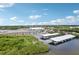 Aerial view of the marina with boat slips and boat storage on a beautiful, sunny day at 2700 Bayshore Blvd # 9404, Dunedin, FL 34698