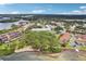 An aerial view showcases the community's lush landscaping and waterfront location on a sunny day at 2700 Bayshore Blvd # 9404, Dunedin, FL 34698
