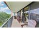Spacious balcony with outdoor furniture offering a tranquil space for relaxation with beautiful views and ample seating at 2700 Bayshore Blvd # 9404, Dunedin, FL 34698
