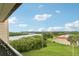 Enjoy serene river views and lush landscaping from this inviting balcony, perfect for relaxing and outdoor enjoyment at 2700 Bayshore Blvd # 9404, Dunedin, FL 34698