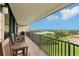 Private balcony with outdoor seating offers stunning water views, perfect for relaxing or entertaining guests at 2700 Bayshore Blvd # 9404, Dunedin, FL 34698