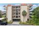 Well-maintained condominium building featuring private balconies and manicured landscaping, offering a desirable coastal living experience at 2700 Bayshore Blvd # 9404, Dunedin, FL 34698
