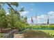 View of the community flags with a peek of the waterfront view at 2700 Bayshore Blvd # 9404, Dunedin, FL 34698