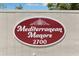 Sign for Mediterranean Manors at 2700 on a bright, sunny day at 2700 Bayshore Blvd # 9404, Dunedin, FL 34698