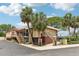 View of the community Cove Club with stairs, a patio, and manicured landscaping at 2700 Bayshore Blvd # 9404, Dunedin, FL 34698