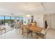Bright dining room with tile floors and a view of the living room and lanai at 2700 Bayshore Blvd # 9404, Dunedin, FL 34698