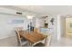 Dining room features a wood table and a seahorse decoration on the wall at 2700 Bayshore Blvd # 9404, Dunedin, FL 34698