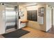 Clean elevator lobby with mailboxes, message board, and accessibility features for residents' convenience and connectivity at 2700 Bayshore Blvd # 9404, Dunedin, FL 34698