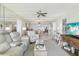 Open-concept living room with dining area and entertainment center at 2700 Bayshore Blvd # 9404, Dunedin, FL 34698
