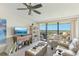 Living area with balcony access, stylish furnishings and natural light at 2700 Bayshore Blvd # 9404, Dunedin, FL 34698