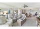 Cozy living room with mirrored wall and open dining area at 2700 Bayshore Blvd # 9404, Dunedin, FL 34698
