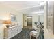 A beautifully decorated lobby area with seating and a large mirror, leading to an elevator for easy access to residences at 2700 Bayshore Blvd # 9404, Dunedin, FL 34698