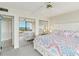 Main bedroom with a mirrored closet and access to the balcony at 2700 Bayshore Blvd # 9404, Dunedin, FL 34698