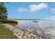 Scenic view of the bay with rocks along the shoreline and a boat anchored on the water at 2700 Bayshore Blvd # 9404, Dunedin, FL 34698